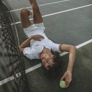 Premium printed polo shirt worn by tenis player on tenis court